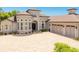 Stunning home exterior with stone accents, a three-car garage, and a circular driveway with pavers at 1855 Cattle Creek Ln, Port Orange, FL 32128
