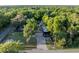Aerial view of home and property showcasing the surrounding tree coverage and lot size at 1899 W Beresford Ave, Deland, FL 32720
