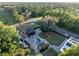 Expansive aerial view showcasing a home, pool, yard and lush surroundings at 1899 W Beresford Ave, Deland, FL 32720