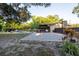 An expansive backyard features a pool, patio, and outdoor kitchen, creating a perfect oasis for relaxation and entertainment at 1899 W Beresford Ave, Deland, FL 32720