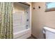 Bathroom featuring a tub with shower, neutral wall paint, and neutral flooring at 1899 W Beresford Ave, Deland, FL 32720