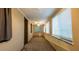 Neutral bedroom with carpeting, beadboard wall trim, and windows at 1899 W Beresford Ave, Deland, FL 32720