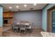 Dining area adjacent to kitchen features wood look flooring and natural light at 1899 W Beresford Ave, Deland, FL 32720