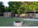 Backyard features a stone fire pit and shed for enjoying the outdoors at 1899 W Beresford Ave, Deland, FL 32720