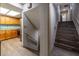 Hallway leading to the kitchen and stairway offering wood look vinyl flooring at 1899 W Beresford Ave, Deland, FL 32720