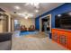 Open living room with bright blue accent wall and stylish furniture and decor at 1899 W Beresford Ave, Deland, FL 32720