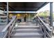 Covered outdoor patio and kitchen area featuring ample seating, bar, and lighting at 1899 W Beresford Ave, Deland, FL 32720