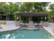 Pool with in-water seating and a covered pergola at 1899 W Beresford Ave, Deland, FL 32720