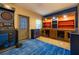 Recreation room featuring dartboard, custom built-in dog kennels, and wood-look flooring at 1899 W Beresford Ave, Deland, FL 32720