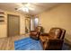 Cozy sitting area with wood look floors and convenient access to a full bathroom at 1899 W Beresford Ave, Deland, FL 32720