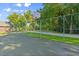 Community basketball court surrounded by chain-link fencing and lush greenery at 2030 Waterford Estates Dr, New Smyrna Beach, FL 32168