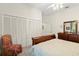 Spacious bedroom featuring a large closet and classic wood furniture at 2030 Waterford Estates Dr, New Smyrna Beach, FL 32168
