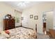 Inviting bedroom with floral accents, comfortable furnishings, and natural light at 2030 Waterford Estates Dr, New Smyrna Beach, FL 32168