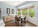 Sun-filled breakfast nook with large windows and seating for four at 2030 Waterford Estates Dr, New Smyrna Beach, FL 32168