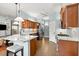 Modern kitchen with granite counters, tile floors, and stainless steel appliances at 2030 Waterford Estates Dr, New Smyrna Beach, FL 32168