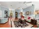 Bright living room with hardwood floors and plenty of natural light at 2030 Waterford Estates Dr, New Smyrna Beach, FL 32168