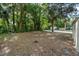 Large backyard with mature trees at 211 S Delaware Ave, Deland, FL 32720