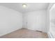 Neutral bedroom features carpet, a closet, and natural light at 211 S Delaware Ave, Deland, FL 32720