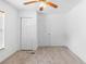 Bedroom featuring neutral carpet, a ceiling fan, and a closet at 211 S Delaware Ave, Deland, FL 32720