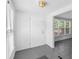 Inviting entryway featuring tile flooring and a white front door, bathed in natural light at 211 S Delaware Ave, Deland, FL 32720