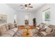 Inviting living room with hardwood floors, neutral furnishings, and natural light at 211 S Delaware Ave, Deland, FL 32720