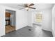 Open floor plan with gray tile flooring connecting dining room and stainless steel kitchen at 211 S Delaware Ave, Deland, FL 32720