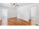 Cozy living room showcasing wood floors and bathroom entrance at 211 S Delaware Ave, Deland, FL 32720