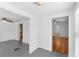 Open living space with tile flooring adjacent to hardwood flooring, offering flexible living options at 211 S Delaware Ave, Deland, FL 32720