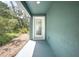 Back porch overlooking natural landscaping at 2145 8Th Ave, Deland, FL 32724