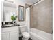 Well-maintained bathroom with a shower-tub combo, white vanity, and modern fixtures for comfort and convenience at 2145 8Th Ave, Deland, FL 32724
