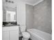 Modern bathroom with grey tiled shower and granite-look sink at 2145 8Th Ave, Deland, FL 32724