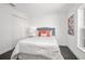 Cozy bedroom features modern decor, plush bedding, and ample natural light from a window at 2145 8Th Ave, Deland, FL 32724