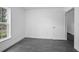 Bedroom featuring natural light, gray wood-look floors, and a view from the window at 2145 8Th Ave, Deland, FL 32724