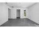 Bright bedroom with gray wood-look floors and a glass door leading to outdoor space at 2145 8Th Ave, Deland, FL 32724
