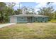 Charming single-story home featuring a new lawn and a front-facing two-car garage at 2145 8Th Ave, Deland, FL 32724