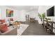 Open-concept living area with gray floors, a dining table, and sleek decor, perfect for entertaining at 2145 8Th Ave, Deland, FL 32724