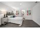 Comfortable primary bedroom with cool-toned decor, a bed, and access to an en-suite bathroom at 2145 8Th Ave, Deland, FL 32724