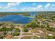 Stunning aerial view of the property near a large lake, showcasing the neighborhood at 2150 Deck Ct, Deltona, FL 32738