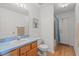 Bright bathroom featuring a single vanity, tiled shower/tub, and tiled floors at 2150 Deck Ct, Deltona, FL 32738
