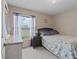 Cozy bedroom featuring natural light, neutral walls and plush carpeting at 2150 Deck Ct, Deltona, FL 32738