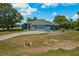 Expansive property featuring a well-kept lawn and driveway leading to an attached two-car garage at 2150 Deck Ct, Deltona, FL 32738