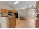Bright eat-in kitchen with wooden cabinets, laminate countertops, and modern appliances at 2150 Deck Ct, Deltona, FL 32738