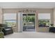 Bright living room featuring lots of natural light, neutral tones, and a view to the outside at 2150 Deck Ct, Deltona, FL 32738