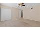 This bedroom features carpeted floors, a ceiling fan, neutral walls, and an entry way at 2200 S Palmetto Ave # B060, Daytona Beach, FL 32119