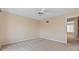 This bedroom features carpeted floors, a ceiling fan, neutral walls, and an entry way at 2200 S Palmetto Ave # B060, Daytona Beach, FL 32119