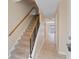 Entryway featuring carpeted stairs with decorative railing and tile flooring at 2200 S Palmetto Ave # B060, Daytona Beach, FL 32119