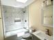 Updated bathroom featuring tiled shower with niche, a modern vanity and framed mirror at 249 Citra St, De Leon Springs, FL 32130