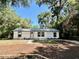 Well-maintained single-story home with tidy landscaping and a welcoming entrance at 249 Citra St, De Leon Springs, FL 32130