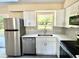 Modern kitchen featuring stainless steel appliances and bright white cabinets at 249 Citra St, De Leon Springs, FL 32130