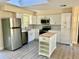 Modern kitchen featuring stainless steel appliances and a convenient center island at 249 Citra St, De Leon Springs, FL 32130